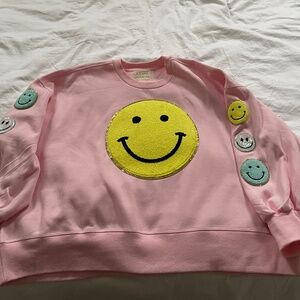 Large smiley front patch with 3 smaller smiley face patches on each arm